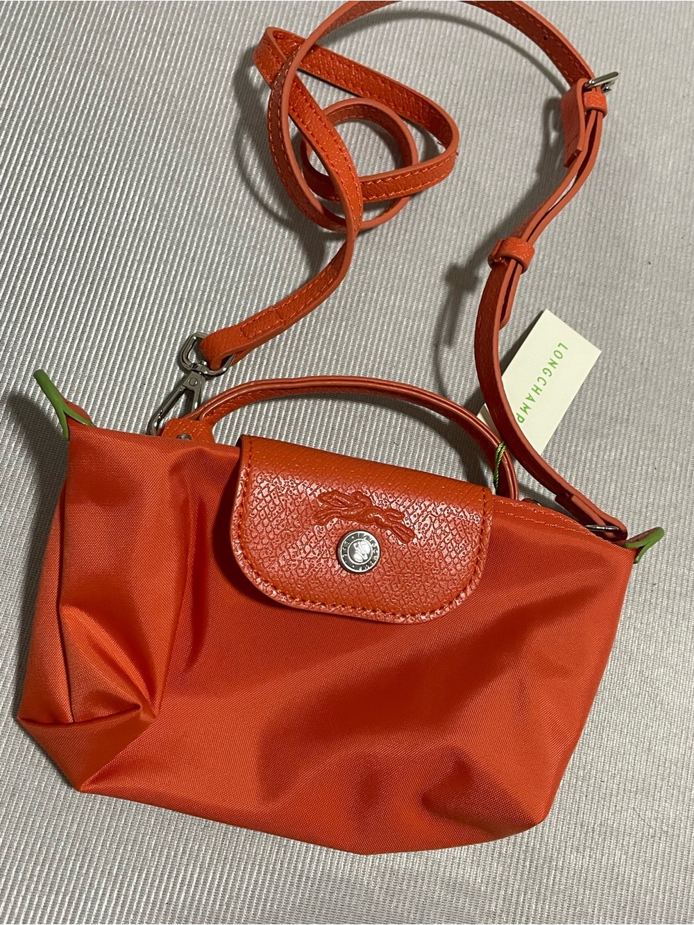 Longchamp orange nylon mini crossbody with leather trim